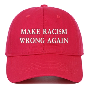 Detailed close-up of white 3D embroidery on a red cotton twill baseball cap