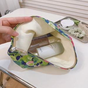 Floral cotton makeup bag with green oil painting print and spacious interior for toiletries