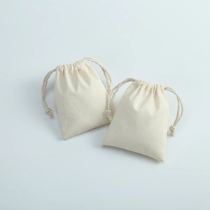 Two natural beige cotton canvas drawstring pouches for jewelry and gift storage