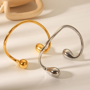 Polished 18K gold and silver stainless steel open bangles with teardrop ends