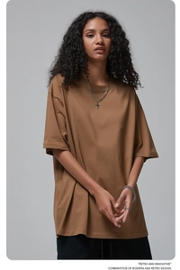Detail of brown oversized cotton t-shirt with retro and innovative typography