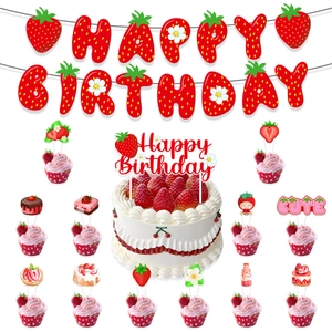 Detail view of strawberry themed birthday party set with banners and cake toppers