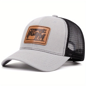 Grey and black mesh trucker hat featuring a vintage cow leather patch on the front