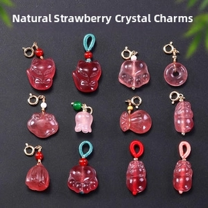 Macro shot of twelve strawberry quartz charms with gold plated clasps and mixed shapes