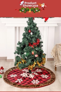 Detail of red and black buffalo plaid Christmas tree skirt with white snowflake patterns