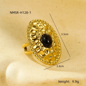 Macro detail of gold vintage hammered ring with black oval stone and size dimensions