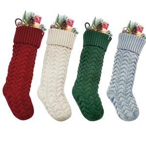 Knitted Christmas stockings set in red, cream, green and blue with festive fillers