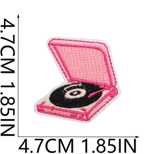 Detail showing pink record player embroidery patch dimensions at 4.7cm with scale lines