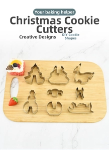 Detailed set of 8 stainless steel Christmas cookie cutters on a wooden board