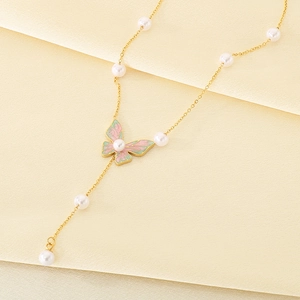 Detail of 18K gold plated necklace with butterfly pendant, pink enamel and pearls