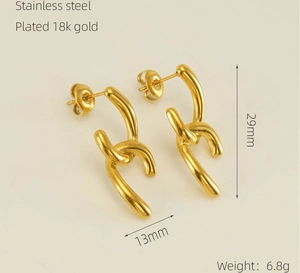 Detail shot of 18k gold plated stainless steel twisted earrings with dimensions 29x13mm