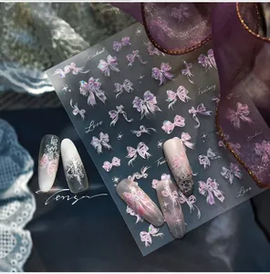 Detail of 3D embossed butterfly nail stickers with pink purple holographic bowknot patterns