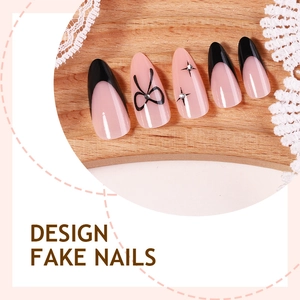 Pink and black bow press-on nails with French tips and sparkling rhinestones
