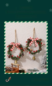 Detail of Christmas wreath with red berries, pine cones, bow and golden bell decoration