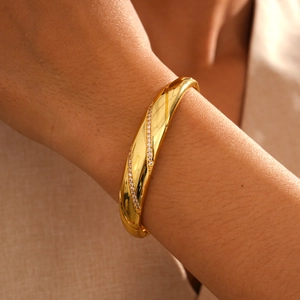 Detail of 18k gold plated bangle featuring twin rows of zircon stones and glossy finish