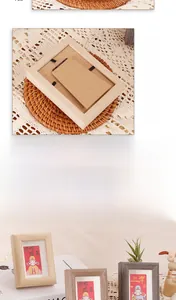 Close-up of wooden photo frames with decorative inspirational prints and detachable backs