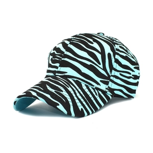 Detailed view of the zebra print pattern and stitching on a cotton baseball cap