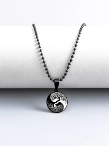 Detail of life tree and yin yang pendant on a black bead chain stainless steel necklace