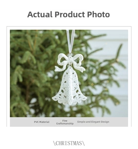 Detailed view of white PVC Christmas bell ornament with glitter and silver ribbon