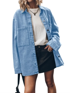 Detailed view of women's light blue denim jacket showing double pockets and wash texture