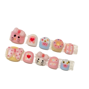 Handmade 3D cartoon cat press-on nails for kids with colorful bows and donut charms