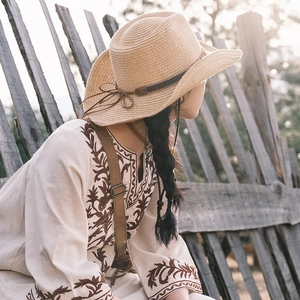 Beige straw cowboy hat with vintage embroidery and brown leather band for summer sun protection