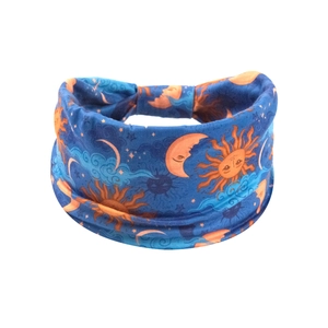 Detail of wide elastic headband with sun and moon pattern on deep blue fabric