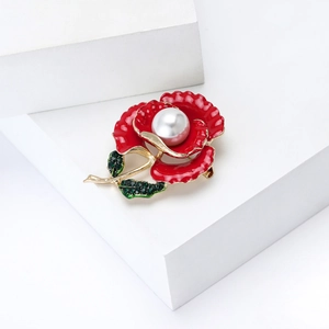 Elegant red enamel pansy brooch with pearl and green crystals on golden base