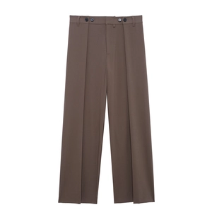 Detail of brown wide-leg trousers featuring double front pleats and four-button waist detail