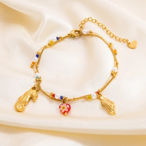 Elegant 18k gold plated stainless steel bracelet with seahorse charms and pearls