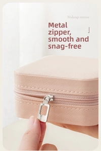 Close-up of pink jewelry box with textured PU leather and smooth silver zipper