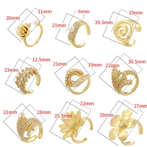 Golden irregular floral ear bone clips set with pearls and zircons in 3x3 grid layout