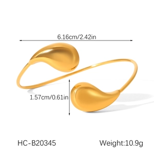 Detail view of gold teardrop cuff bracelet with 6.16cm width and 10.9g weight specs