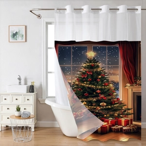 Detail of Christmas shower curtain featuring metal rings and festive tree pattern