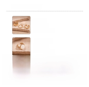 Detail view of gold resin geometric rings showing material specs and weight attributes