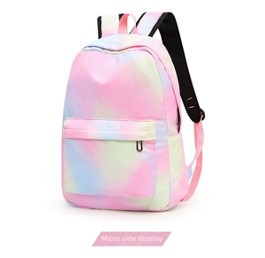 Side view of rainbow gradient backpack showing front zipper pocket and side mesh pouch