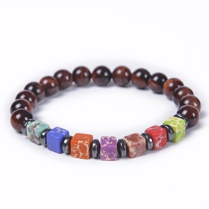 Detail of elastic bracelet featuring 8mm round tiger eye beads and colorful square stones