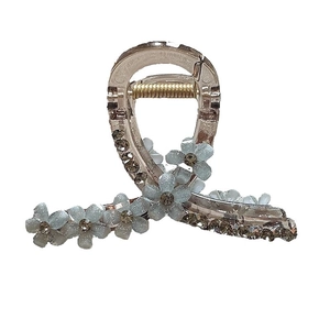 Elegant crystal flower hair claw clip with blue matte petals and sparkling rhinestones