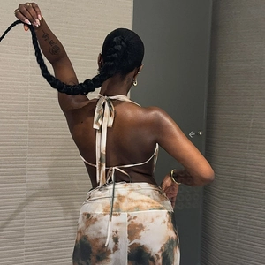 Women's backless halter neck two-piece set with marble print and lace-up back detail