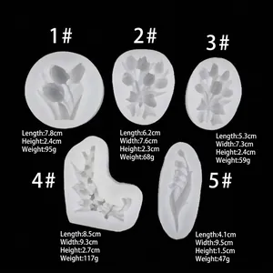 Five assorted tulip and lily of the valley silicone molds for fondant and gypsum crafts