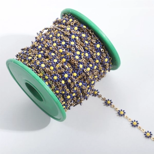 Detail of blue and yellow enamel daisy chain on a roll with 18K gold plated finish