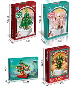 Macro view of four DIY building block bonsai sets including Christmas and orange trees