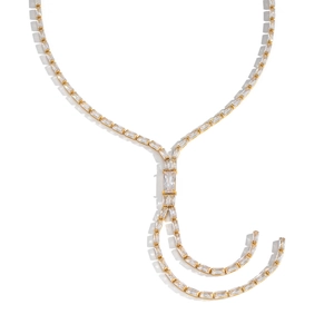 Golden bamboo joint Y-necklace with baguette zircon tassels on a white background