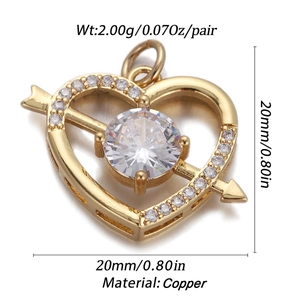 Detail of a 20mm gold heart pendant with clear zircon stones and arrow design on copper