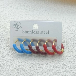 Three pairs of colorful enamel stainless steel hoop earrings in red, burgundy and blue