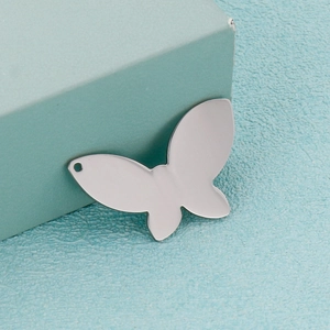 Polished silver butterfly pendant in stainless steel displayed on light blue gift box