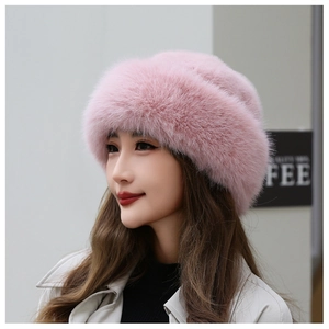 Close-up of pink faux fur winter hat showing dense fluffy texture and rolled brim style