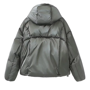 Detail of hooded metallic puffer jacket showing high-gloss gray fabric and quilted texture