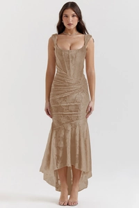 Detailed view of champagne lace jacquard fabric on a strapless corset maxi dress