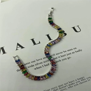 Detailed view of rainbow rectangle cut gemstones set in silver finish metal chain
